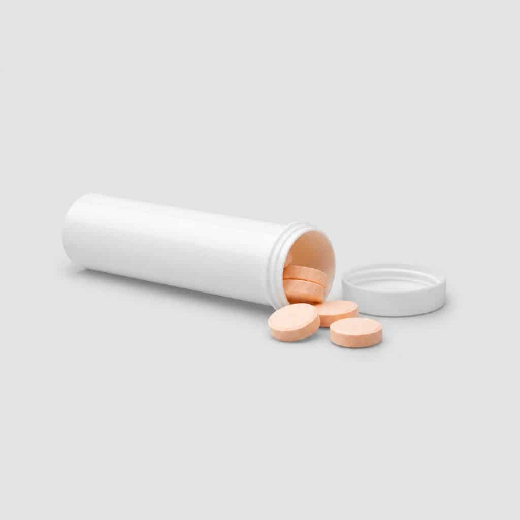 Tube de comprimés à croquer à la vitamine C ouvert